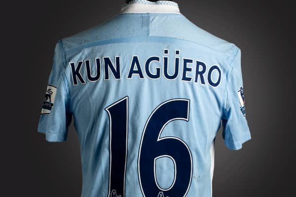 The historic blue Manchester City No.16 jersey was worn by Sergio Agüero Credit: Graham Budd Auctions / SWNS