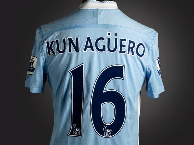 The historic blue Manchester City No.16 jersey was worn by Sergio Agüero Credit: Graham Budd Auctions / SWNS