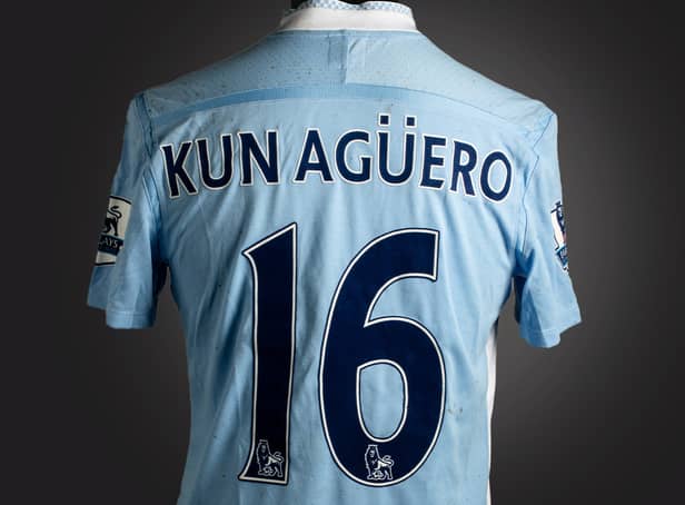 <p>The historic blue Manchester City No.16 jersey was worn by Sergio Agüero Credit: Graham Budd Auctions / SWNS</p>
