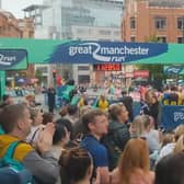 Runners and spectators join the applause in tribute to those who died in the Manchester Arena attack