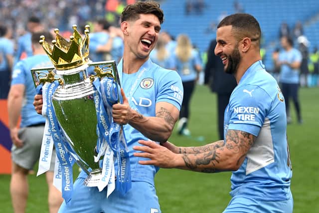 Manchester City and England internationals John Stones, left, and Kyle Walker celebrate Premier League title win on Sunday