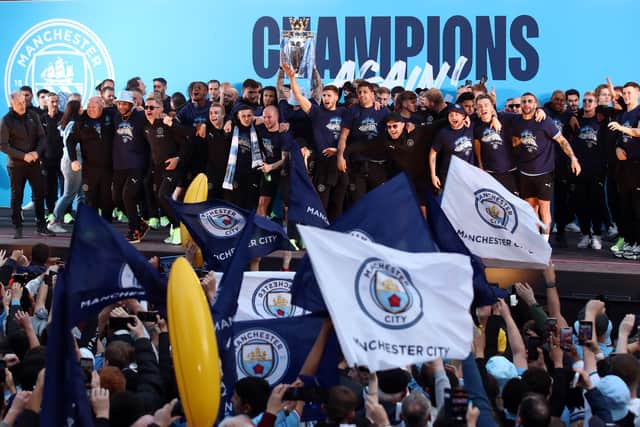 City’s players and staff paraded the Premier League trophy through the streets of Manchester on Monday. Credit: Getty.