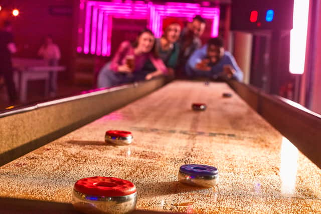 Shuffleboard at the Boom Battle Bar