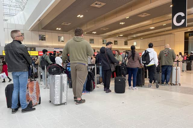 Passengers queue for check in at Manchester Airport’s Terminal 2 in April Credit: Getty