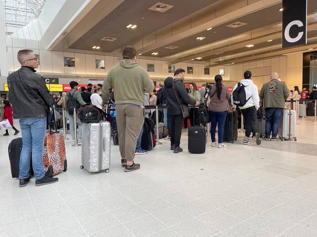 Passengers queue for check in at Manchester Airport’s Terminal 2 in April Credit: Getty