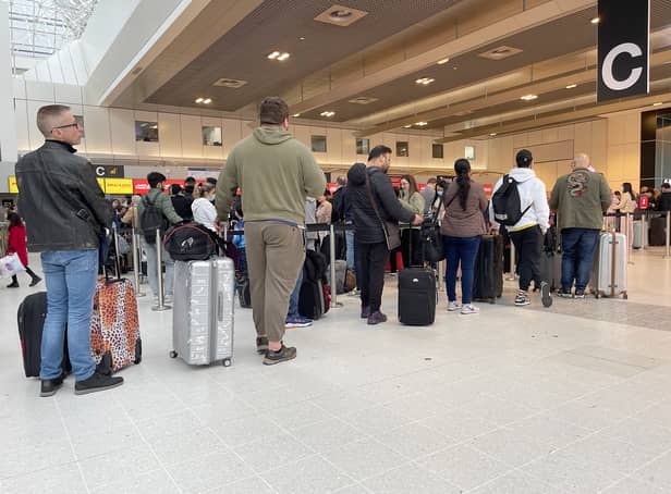 <p>Passengers queue for check in at Manchester Airport’s Terminal 2 previously Credit: Getty</p>