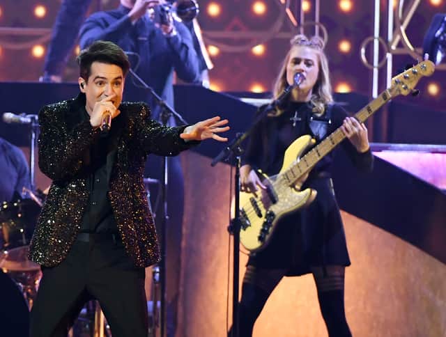 Brendon Urie (L) and Nicole Row of Panic! at the Disco perform during the 2019 Billboard Music Awards at MGM Grand Garden Arena on May 1, 2019 in Las Vegas, Nevada. 