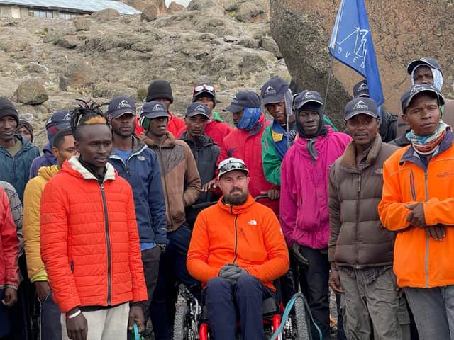 Martin Hibbert and porters. Credit: Martin's Mountain / SWNS