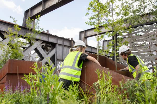 Planting work is under way at Castlefield Viaduct to transform it into a green urban sky park. Photo: Annapurna Mellor/National Trust Images