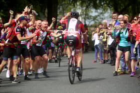 Large crowds come to cheer on the Ironman triathletes. Photo by Charlie Crowhurst/Getty Images for IRONMAN