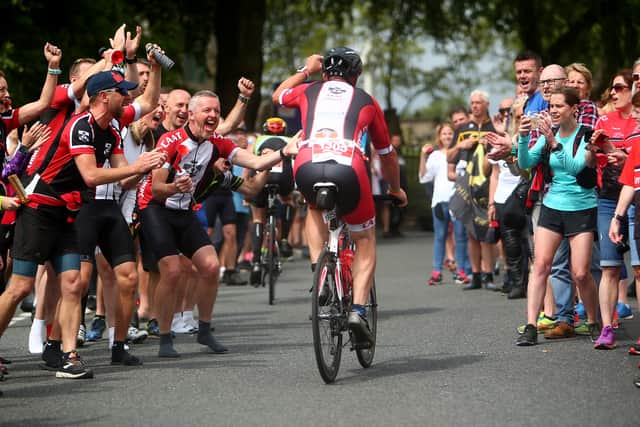 Large crowds come to cheer on the Ironman triathletes. Photo by Charlie Crowhurst/Getty Images for IRONMAN