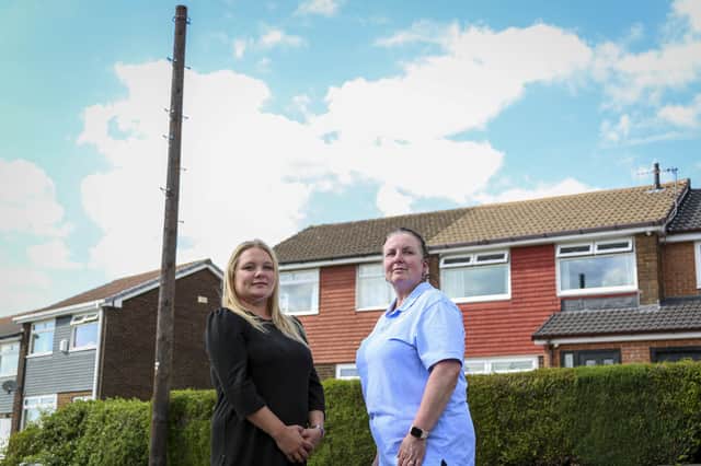<p>Neighbours Sophie Johnson (left) and Julia Withall (right)by the new pole Credit: SWNS</p>
