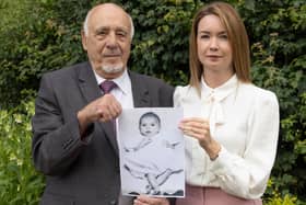 Nuclear test veteran John Morris and his granddaughter Laura Morris holding a picture of John’s son Stephen. Photo: Phil Harris