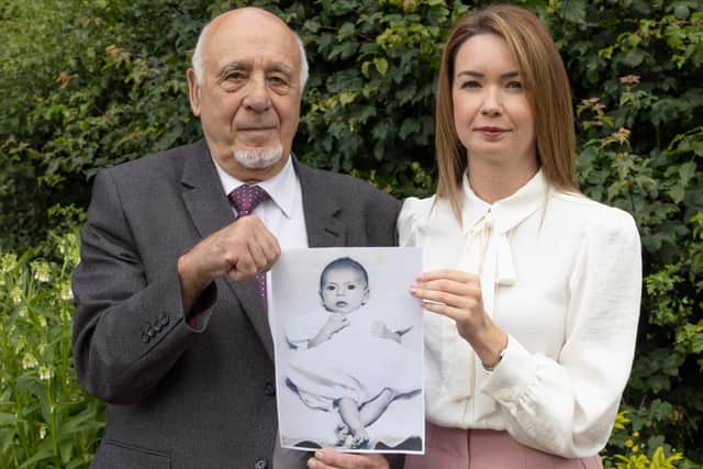 Nuclear test veteran John Morris and his granddaughter Laura Morris holding a picture of John’s son Stephen. Photo: Phil Harris