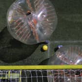 You can enjoy a five-a-side game of bubble football (Photo by RAUL ARBOLEDA/AFP via Getty Images)