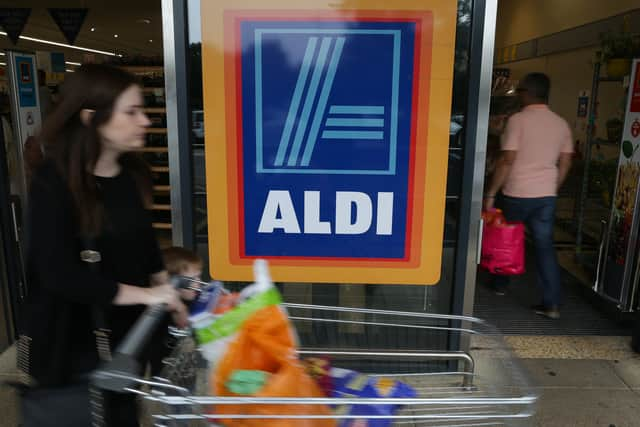 Customer pushing a trolley at Aldi in London (Getty Images)