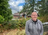 Dave Marsh with the boarded up Swinton Park Golf Club building the background