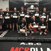Veterans with their certificates after completing the BoxWise programme