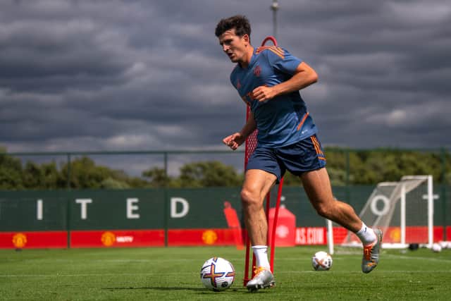 Harry Maguire was back at Carrington on Monday. Credit: Getty.