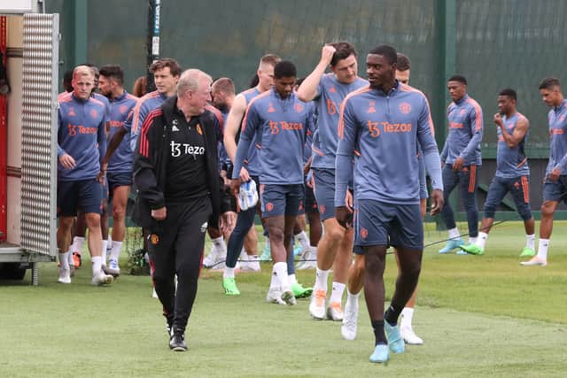 United's player emerged onto the training pitch together. Credit: Getty.