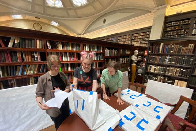 Volunteers unpacking the Carrolup works on their arrival in Manchester