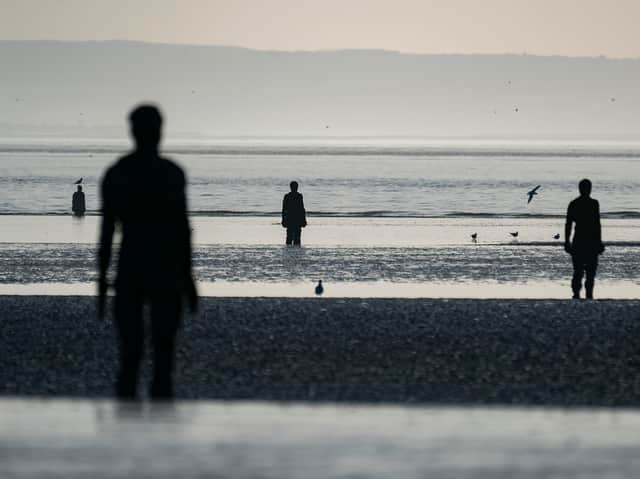 Sculptures making up part of Antony Gormley’s Another Place at Crosby beach. Photo: Christopher Furlong/Getty Images