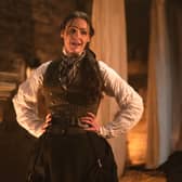 Suranne Jones as Anne Lister in Gentleman Jack, stood next to a fireplace looking flustered, hands on her hips (Credit: BBC/Lookout Point/HBO/Aimee Spinks)