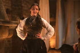 Suranne Jones as Anne Lister in Gentleman Jack, stood next to a fireplace looking flustered, hands on her hips (Credit: BBC/Lookout Point/HBO/Aimee Spinks)