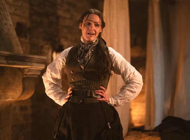 <p>Suranne Jones as Anne Lister in Gentleman Jack, stood next to a fireplace looking flustered, hands on her hips (Credit: BBC/Lookout Point/HBO/Aimee Spinks)</p>