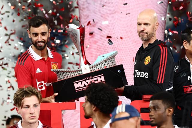 United were presented with a trophy after the game. Credit: Getty.