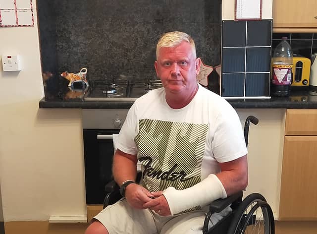 David Judd says he was pushed in his wheelchair off a plane by a pilot after support staff failed to arrive
