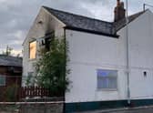 The fire broke out in the former Woodman pub in London Road, Hazel Grove Credit: Greater Manchester Fire and Rescue