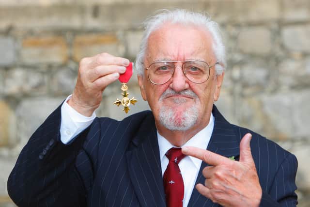 Bernard Cribbins poses with his Officer of the British Empire (OBE) medal after receiving it during an Investiture ceremony with the Princess Anne, Princess Royal at Windsor Castle, on November 3, 2011