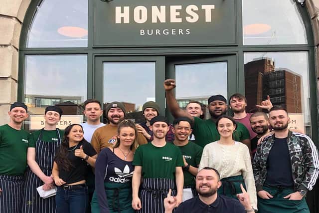 Staff from Honest Burgers Manchester gather for a picture outside the restaurant
