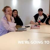 Ashley Jones (R) telling his employees that he’s taking them to Ibiza as a reward for their hard work Credit: via SWNS