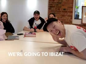Ashley Jones (R) telling his employees that he’s taking them to Ibiza as a reward for their hard work Credit: via SWNS