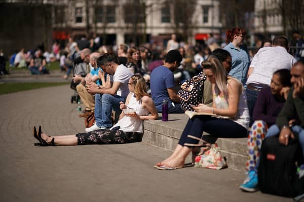 Folk enjoying a previous heatwave in Piccadilly Gardens in Manchester Credit: Getty
