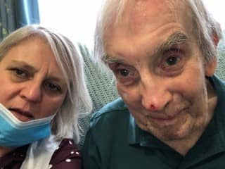 <p>Catherine Larkin and her father Tom O’Brien reunited at his care home shortly after coronavirus restrictions were lifted. Credit: Catherine Larkin</p>