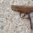  A Manchester couple were left stunned when their two young children found this weapon at a reservoir Credit: Jeny Chapman / SWNS