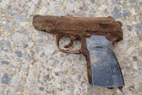  A Manchester couple were left stunned when their two young children found this weapon at a reservoir Credit: Jeny Chapman / SWNS