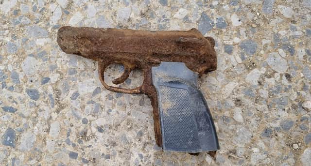  A Manchester couple were left stunned when their two young children found this weapon at a reservoir Credit: Jeny Chapman / SWNS