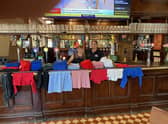Joseph Holt Danielle and Blane McIntosh at the Bricklayer’s Arms in Salford with donated school uniforms Credit: LDRS