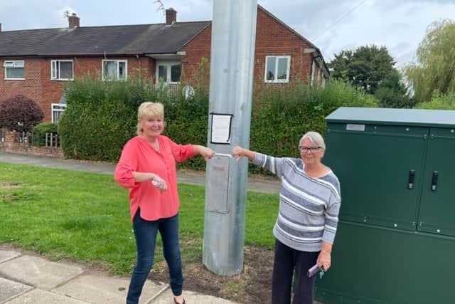 Veronica Atkin and Denise Roof with 6G mast in Cheadle. Image: LDRS. 