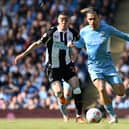 Newcastle United’s Miguel Almiron vies with Manchester City star Jack Grealish  (Photo by PAUL ELLIS/AFP via Getty Images)