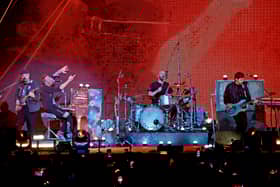 (L-R) Jonny Buckland, Chris Martin, Will Champion, and Guy Berryman of Coldplay perform onstage for iHeartRadio ALTer EGO presented by Capital One