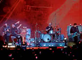 (L-R) Jonny Buckland, Chris Martin, Will Champion, and Guy Berryman of Coldplay perform onstage for iHeartRadio ALTer EGO presented by Capital One