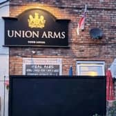 Mural of England Lionesses forward Ella Toone painted on the side of the Union Arms pub in her hometown of Tyldesley Credit: swns