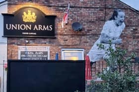 Mural of England Lionesses forward Ella Toone painted on the side of the Union Arms pub in her hometown of Tyldesley Credit: swns