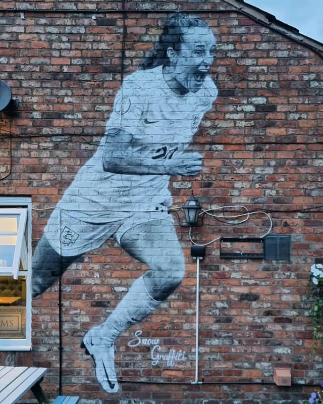 Mural of England Lionesses forward Ella Toone painted on the side of the Union Arms pub in her hometown of Tyldesley Credit: SWNS