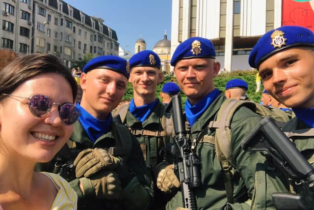 Maria Romanenko poses with officers from the Ukrainian National Guard during Kyiv’s Independence Day celebrations in 2021. Credit: Maria Romanenko